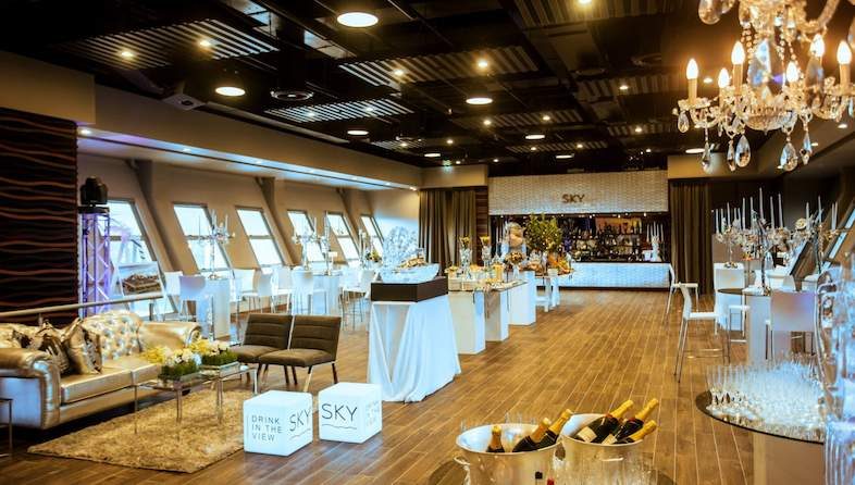 Elegant product launch event venue with lounge seating and bar